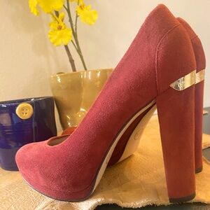 Michael Kors cranberry, red, pink platform pumps.